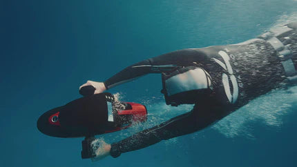 A man is using sublue sea scooter for diving