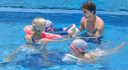 A family of four is enjoying the pool and using the Sublue Hagul EZ pool scooter