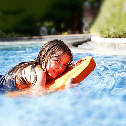 Child with SUBLUE Swii kickboard, enjoying fun in a blue pool.