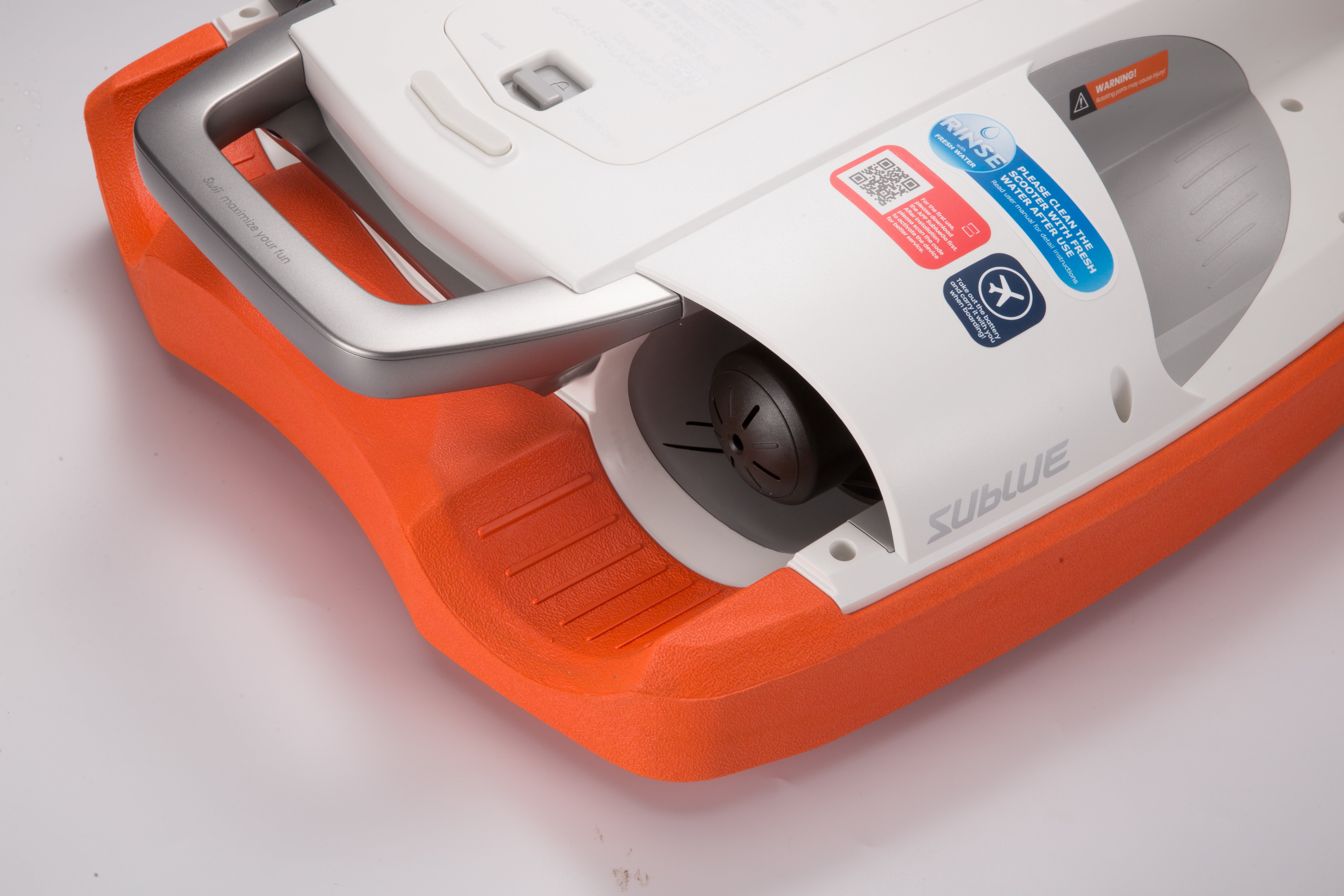 Close-up of SUBLUE Swii Electronic Kickboard in white and orange showcasing design features.