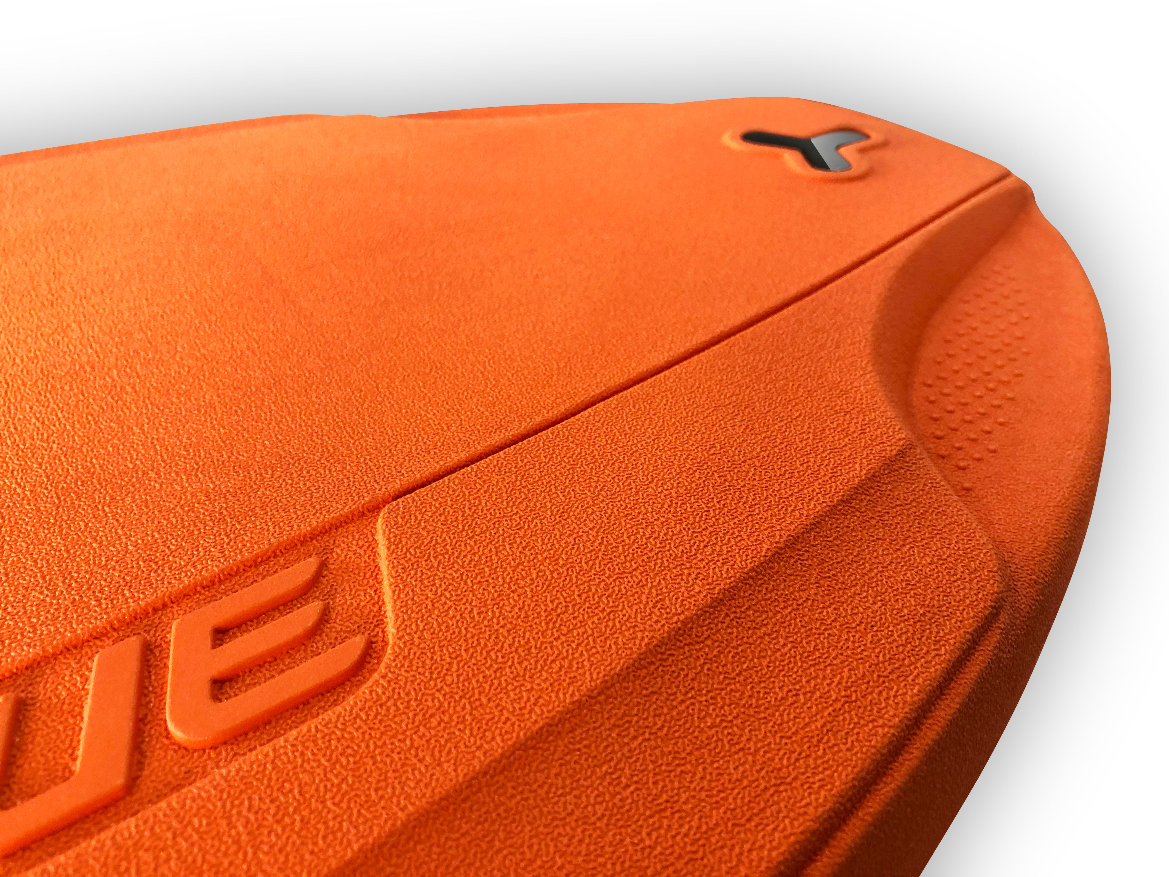 Close-up of SUBLUE Swii kickboard highlighting bright orange texture and logo.