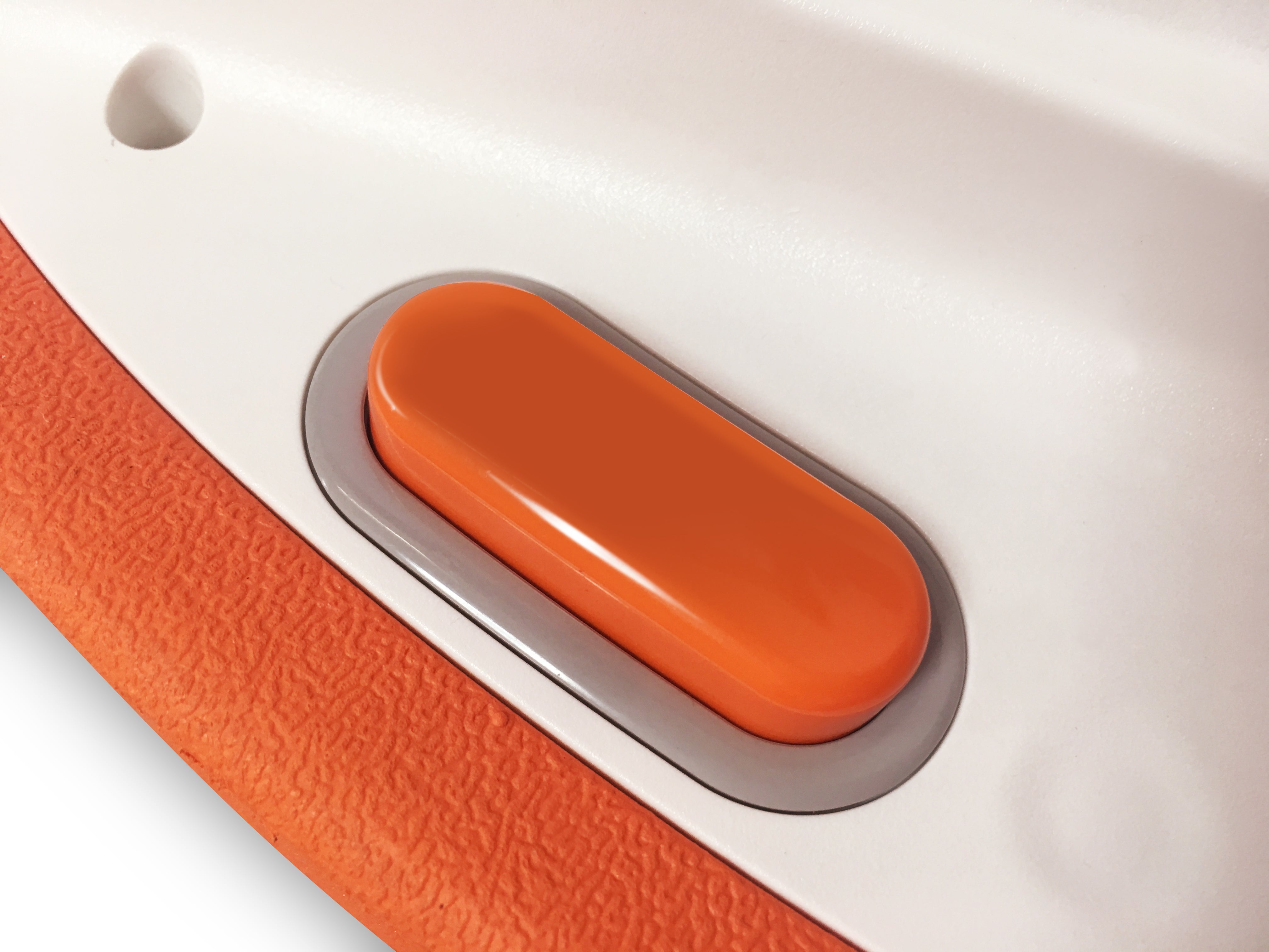 Close-up of control button on SUBLUE Swii Electronic Kickboard in orange.